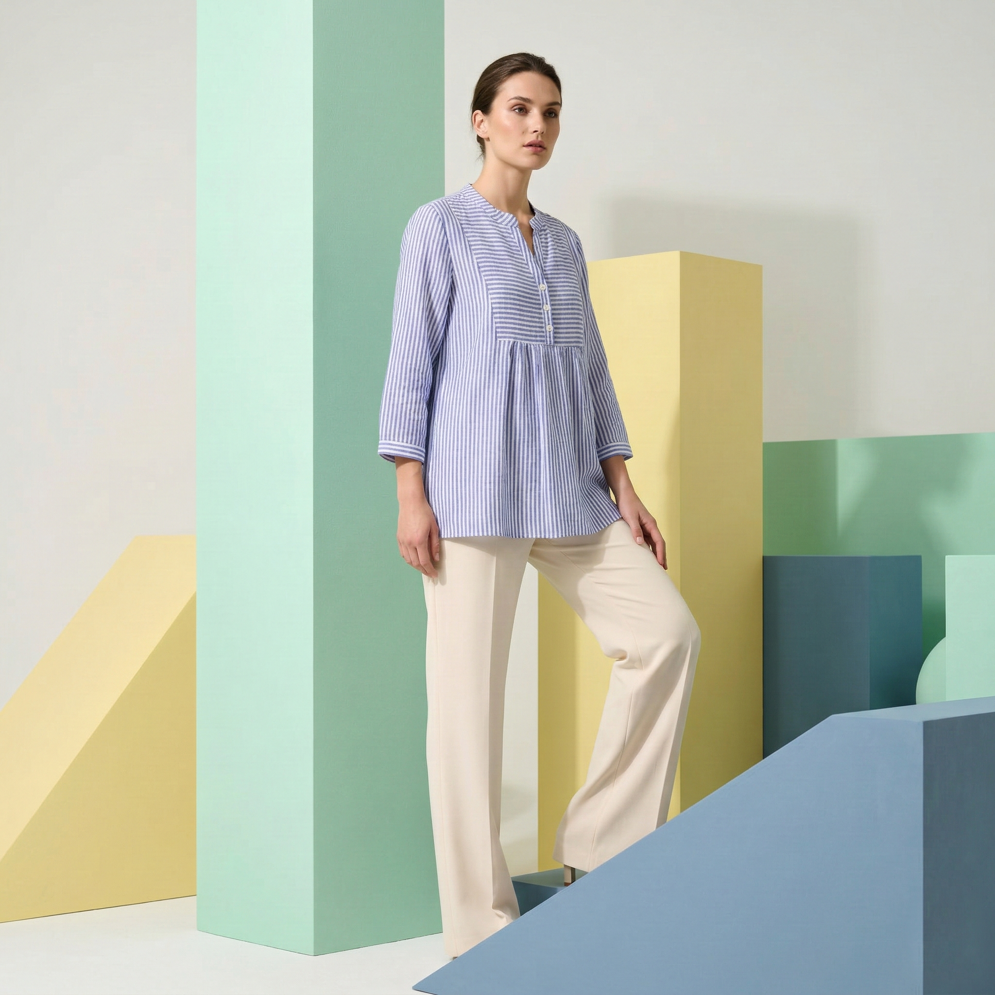 Elegant blue striped button-up tunic with a pleated bodice