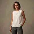 Chic sleeveless ivory blouse with a small keyhole necklin
