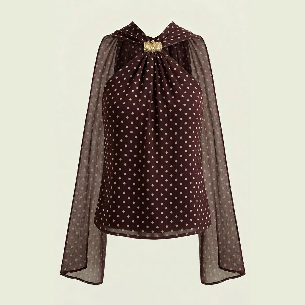 Brown polka dot blouse with a gathered neckline and flowing sleeves.