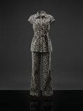 Leopard print beige and black set with a belted top and wide-leg pants.
