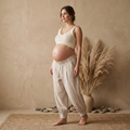 Casual beige high-waisted linen-style trousers with an elastic waist