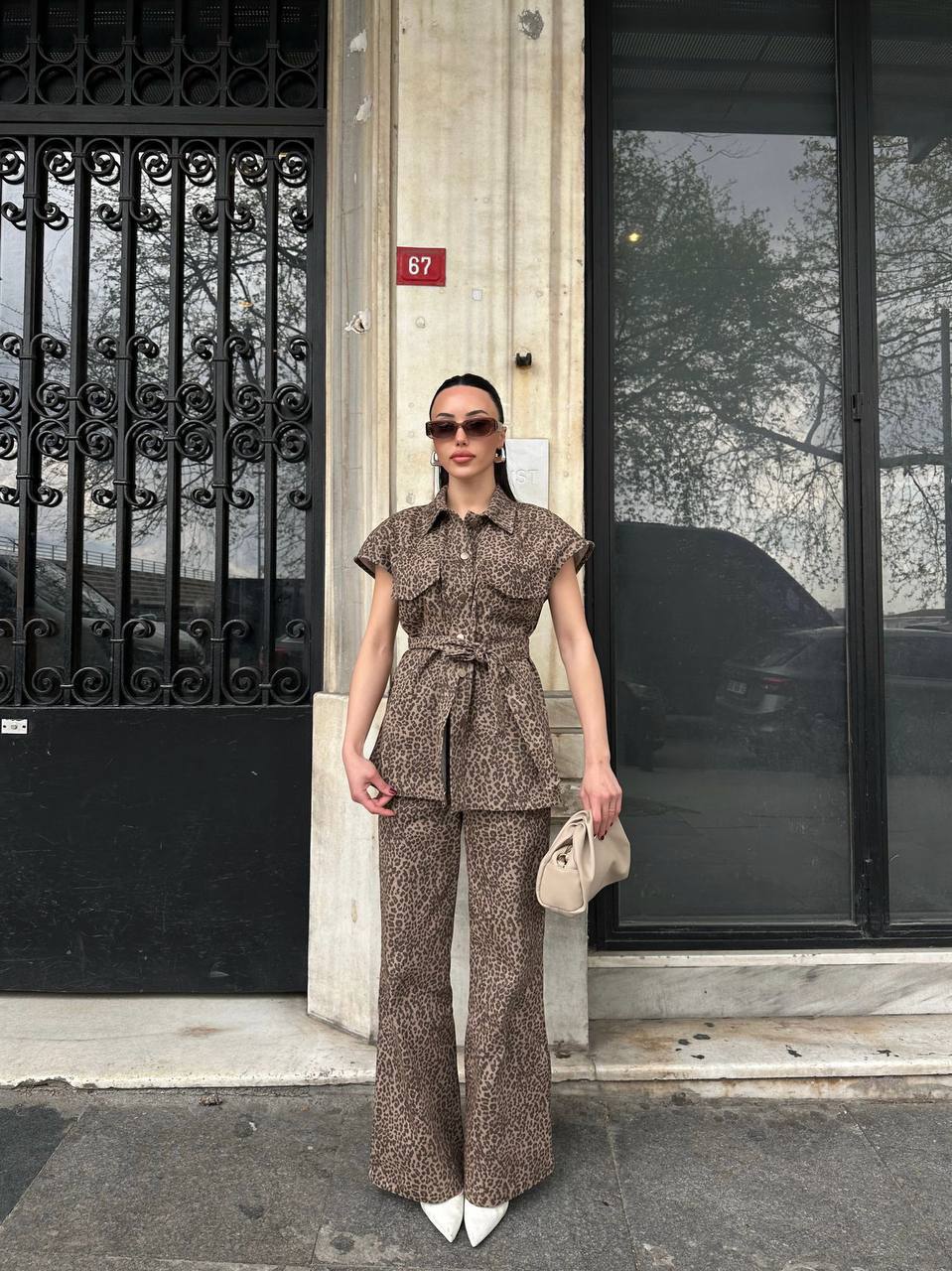 Leopard print beige and black set with a belted top and wide-leg pants.