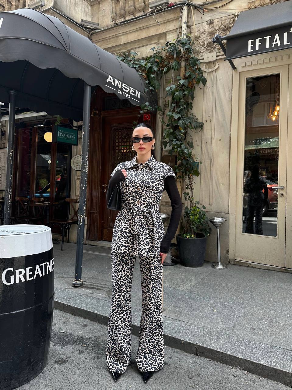 Leopard print beige and black set with a belted top and wide-leg pants.